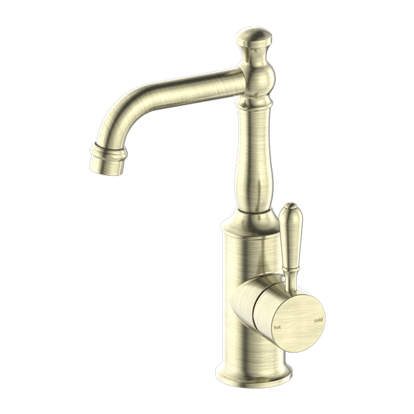 A aged brass basin mixer tap with a matching aged brass handle.