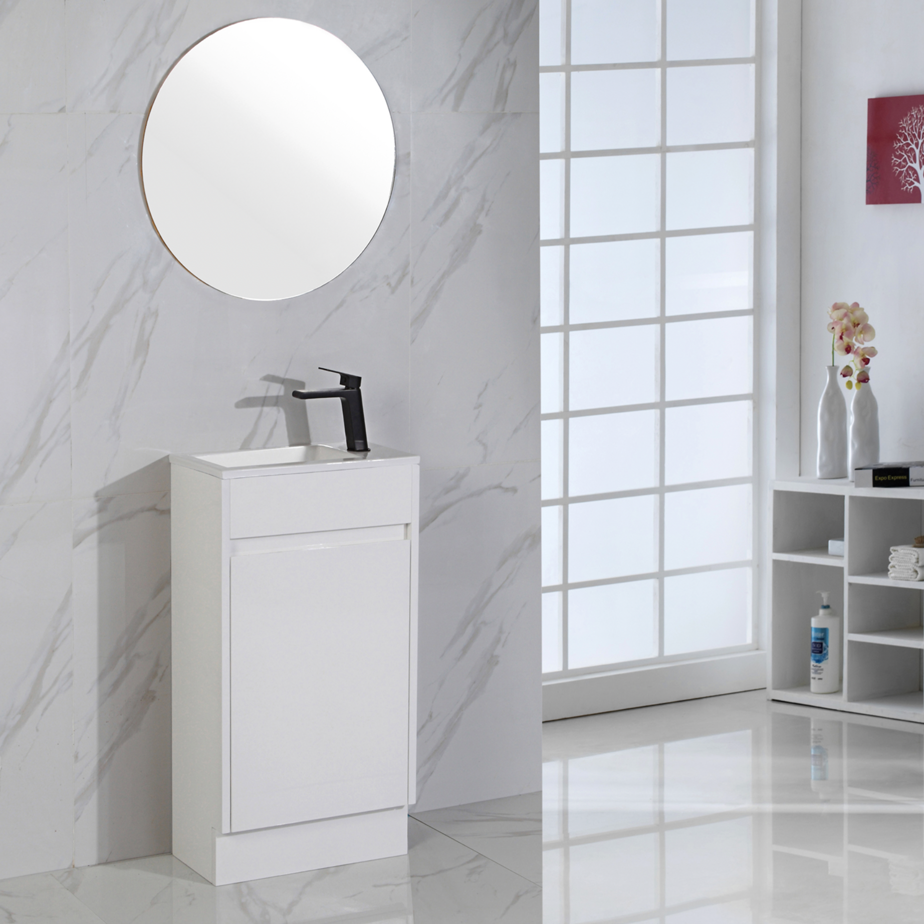 Bathroom setup with a white vanity unit, round mirror, and black basin mixer tap