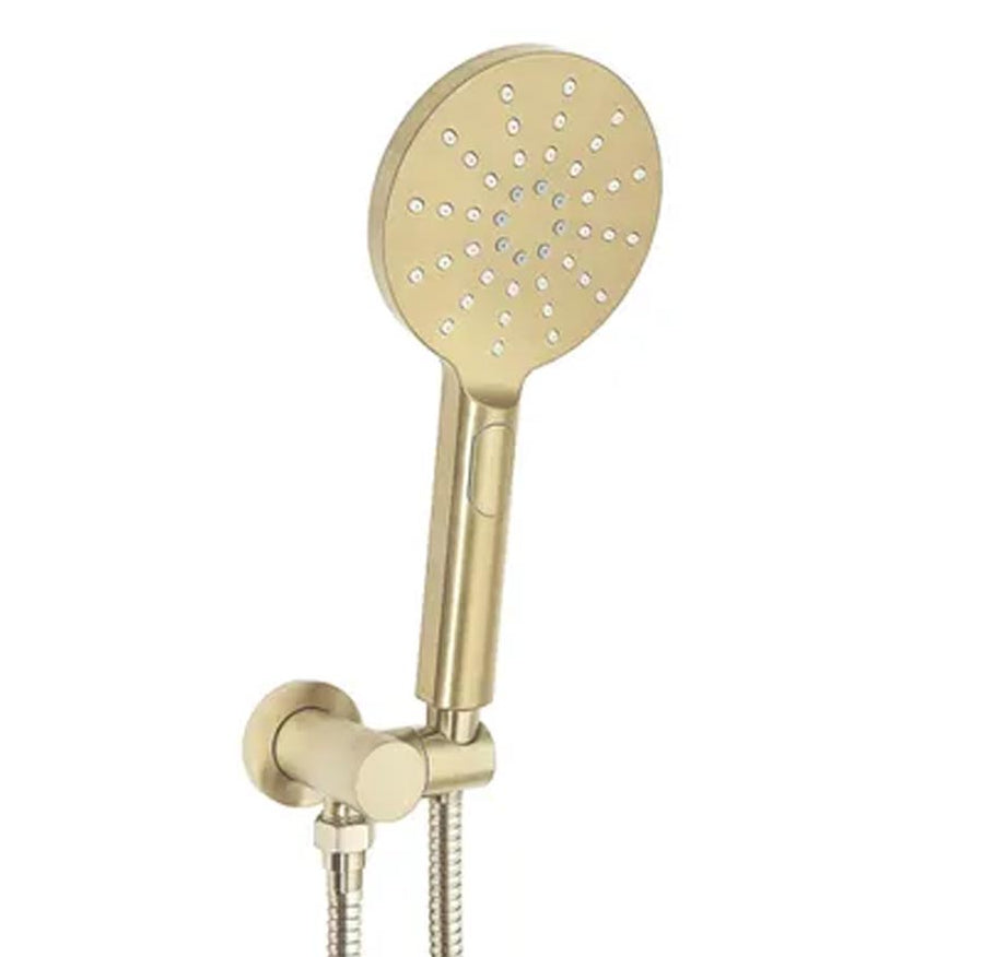 A brushed gold hand shower with a round design and multiple nozzles, mounted on a wall with a chrome-plated hose.