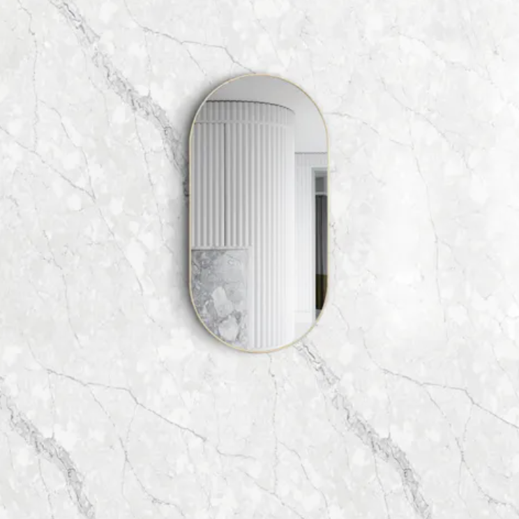 Oval framed gold bathroom mirror