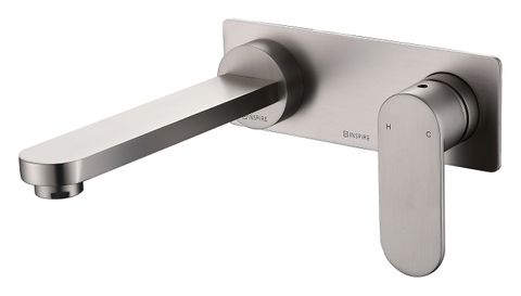 A brushed nickel wall basin mixer with a sleek oval handle.